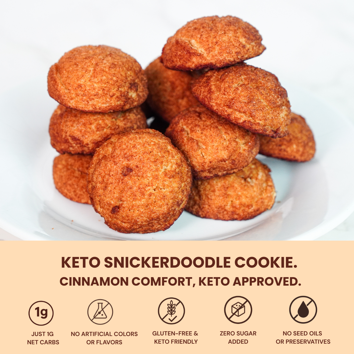 Keto snickerdoodle cookies stacked on a plate. Zero sugar, 2g net carbs, gluten-free, and keto friendly.