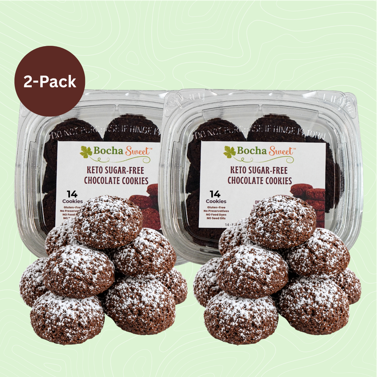 Two packages of Keto Snow-Dusted Chocolate Cookies, each containing 14 rich chocolate cookies dusted with powdered sugar, 10 oz per package.