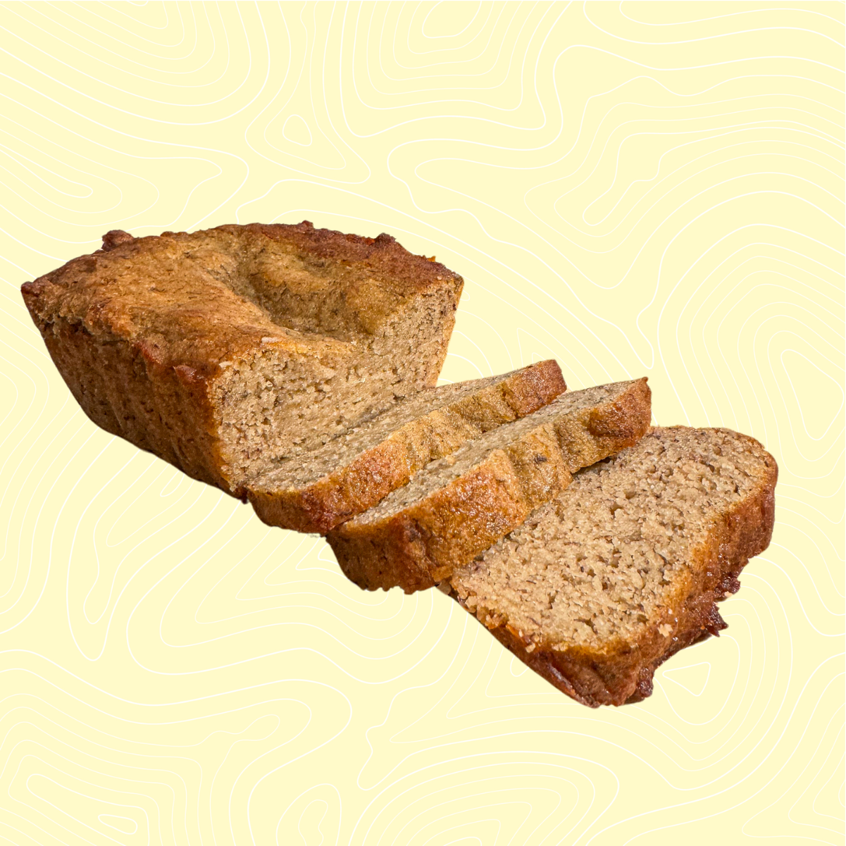 Golden-brown banana bread sliced into four pieces, showcasing its moist texture and fluffy interior. The loaf is set against a light yellow background with a subtle topographic pattern, highlighting a wholesome, sugar-free treat.