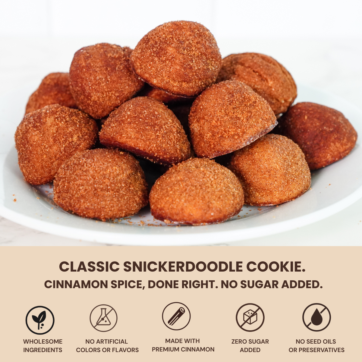 Snickerdoodle cookies on a white plate with cinnamon spice flavor description.