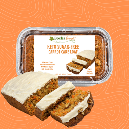 Keto sugar-free carrot cake loaf with cream cheese frosting on an orange background