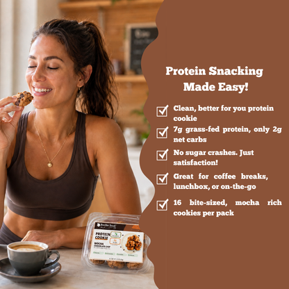 Woman eating a protein cookie with product packaging and promotional text on a brown background